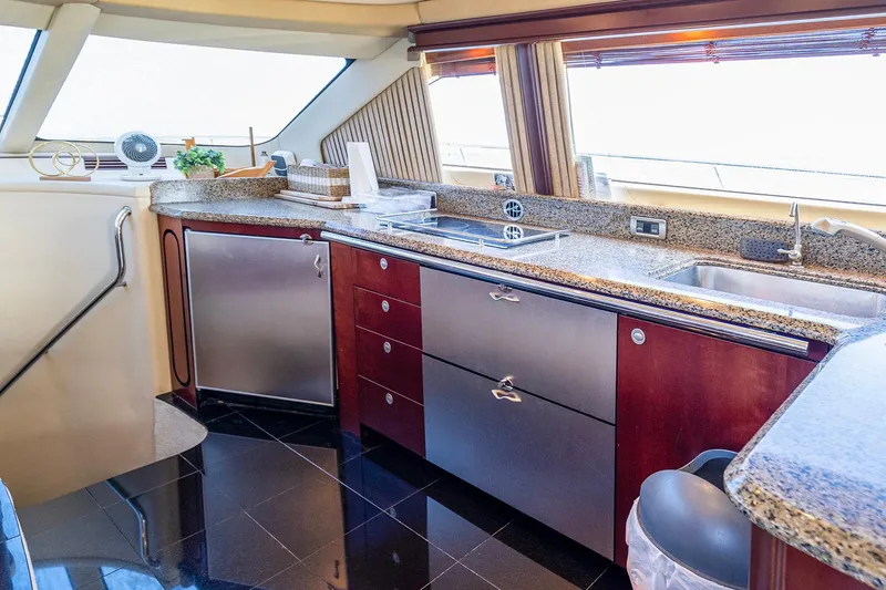 Slide: The Image of Luxurious kitchen interior of 2006 Sea Ray 58 Sedan Bridge yacht with modern amenities. - 21