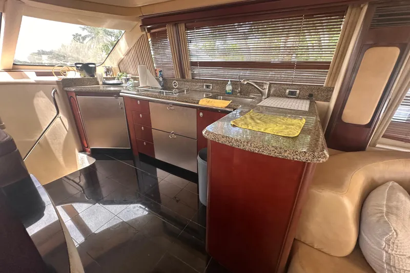 Slide: The Image of Luxurious kitchen interior of 2006 Sea Ray 58 Sedan Bridge yacht. - 22