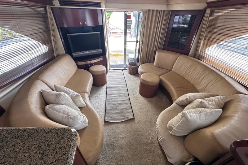 Slide: The Image of Luxurious interior of 2006 Sea Ray 58 Sedan Bridge yacht with plush seating and modern decor. - 24