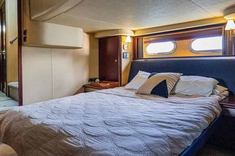 Slide: The Image of Luxurious bedroom interior of 2006 Sea Ray 58 Sedan Bridge yacht. - 29