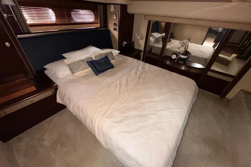 Slide: The Image of Luxurious bedroom interior of 2006 Sea Ray 58 Sedan Bridge yacht with elegant bedding. - 30