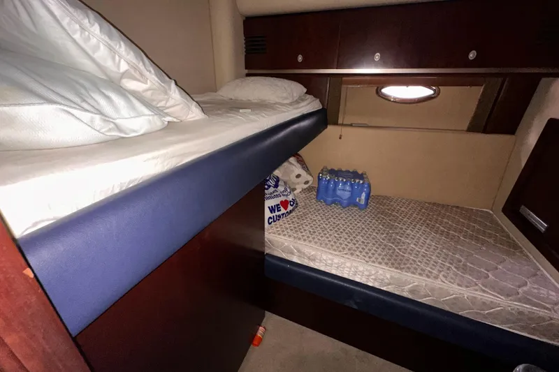 Slide: The Image of Interior cabin of 2006 Sea Ray 58 Sedan Bridge with bunk beds and storage. - 34