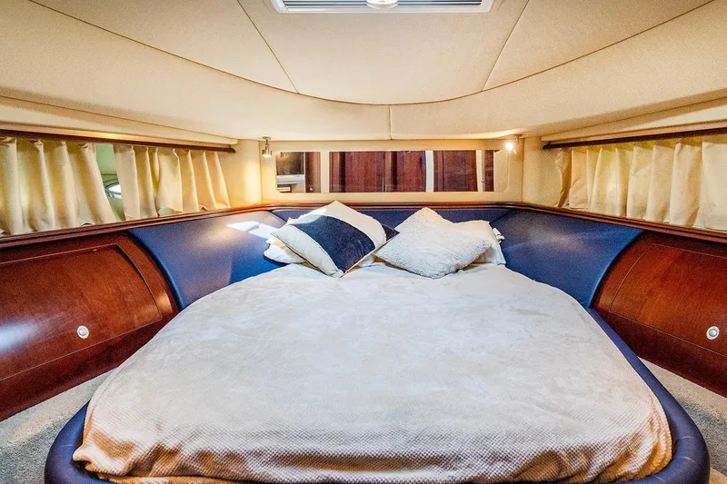 Slide: The Image of Luxurious bedroom interior of 2006 Sea Ray 58 Sedan Bridge yacht. - 35