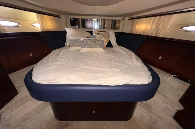 Slide: The Image of Luxurious bedroom interior of 2006 Sea Ray 58 Sedan Bridge yacht with plush bedding. - 36