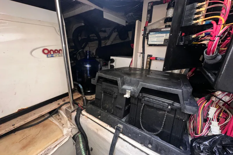 Slide: The Image of Engine room of 2006 Sea Ray 58 Sedan Bridge with Onan generator and electrical components. - 41