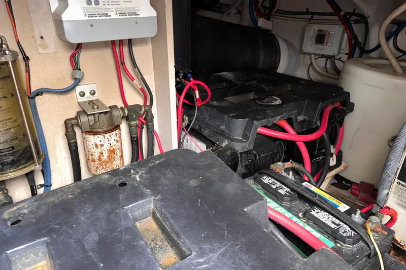 Slide: The Image of Engine compartment of a 2006 Sea Ray 58 Sedan Bridge with batteries and wiring. - 42