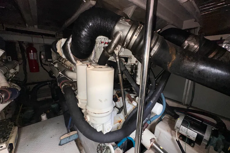 Slide: The Image of Engine room of a 2006 Sea Ray 58 Sedan Bridge yacht, showcasing complex machinery. - 43