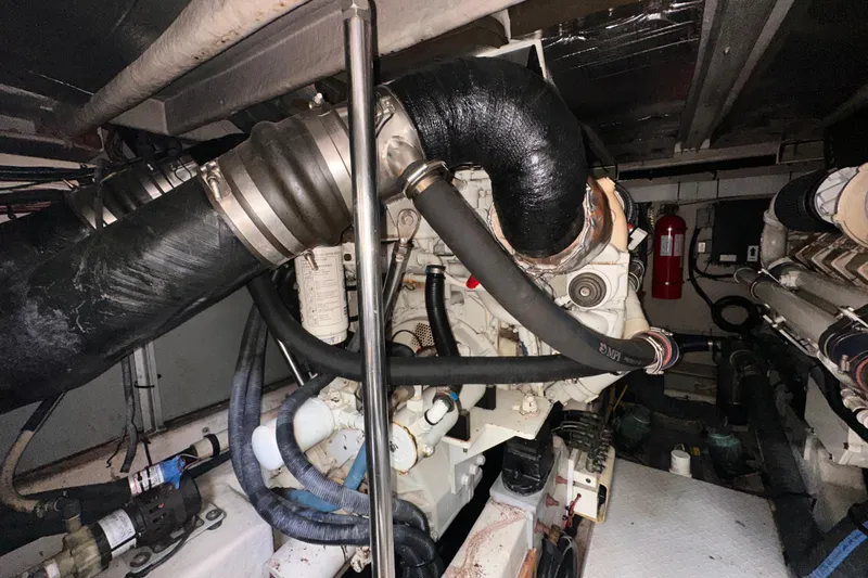 Slide: The Image of Engine room of a 2006 Sea Ray 58 Sedan Bridge yacht, showcasing mechanical components. - 44