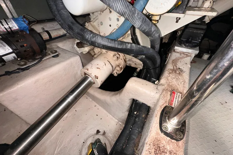 Slide: The Image of Engine compartment of a 2006 Sea Ray 58 Sedan Bridge with visible mechanical components. - 45