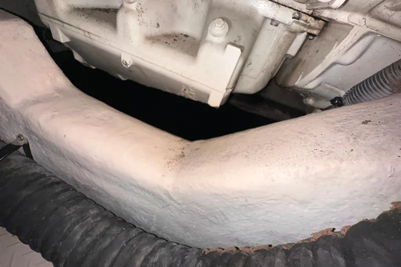 Slide: The Image of Engine compartment of a 2006 Sea Ray 58 Sedan Bridge yacht, showing mechanical components. - 53