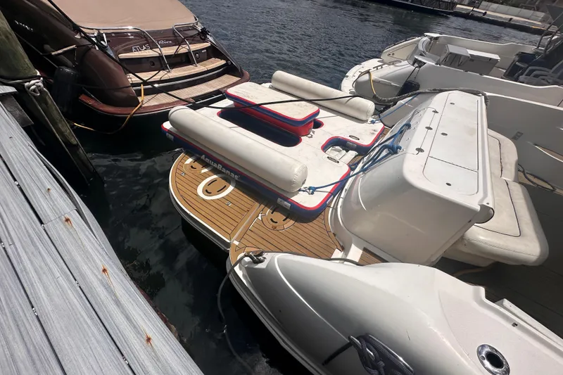 Slide: The Image of 2006 Sea Ray 58 Sedan Bridge yacht docked with inflatable water toys. - 6
