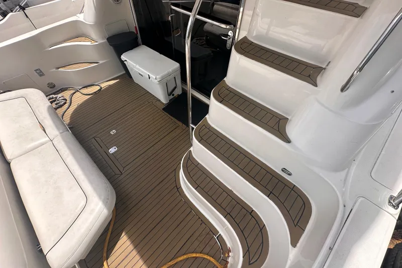Slide: The Image of Interior view of 2006 Sea Ray 58 Sedan Bridge yacht with seating and stairs. - 9