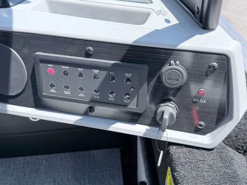 Slide: The Image of Dashboard of 2026 Starcraft 188 Delta DC with switches and ignition key. - 36