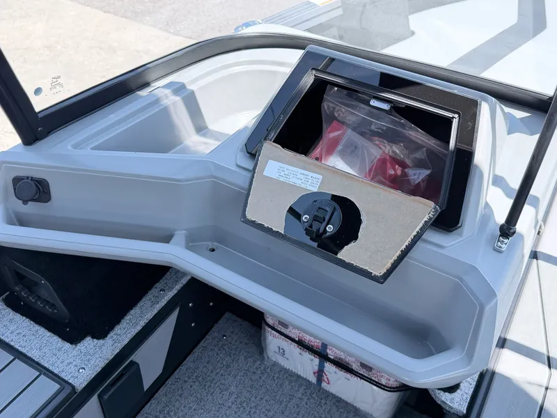 Slide: The Image of Starcraft 188 Delta DC 2026 boat console with storage compartment. - 6