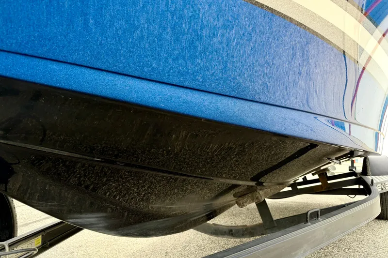Slide: The Image of Close-up of a 2012 Skeeter SL 185 boat hull on a trailer. - 11