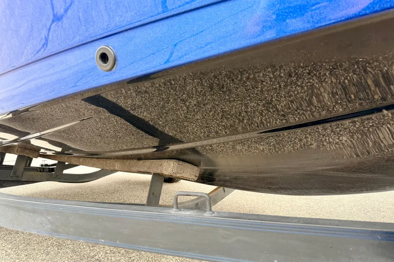 Slide: The Image of Underside view of a 2012 Skeeter SL 185 boat on a trailer. - 12