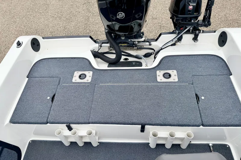 Slide: The Image of 2012 Skeeter SL 185 boat deck with motor and rod holders. - 20