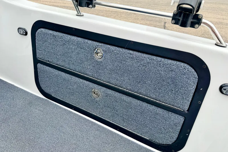 Slide: The Image of Storage compartments on a 2012 Skeeter SL 185 boat interior. - 29
