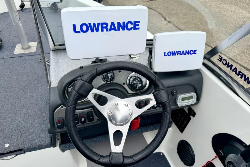 Slide: The Image of 2012 Skeeter SL 185 boat dashboard with Lowrance electronics and steering wheel. - 37