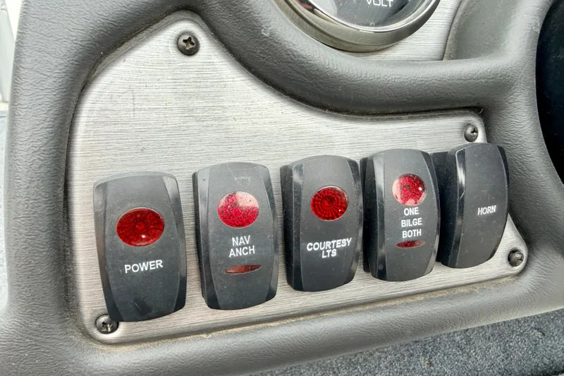 Slide: The Image of Control panel of a 2012 Skeeter SL 185 boat with labeled switches. - 39