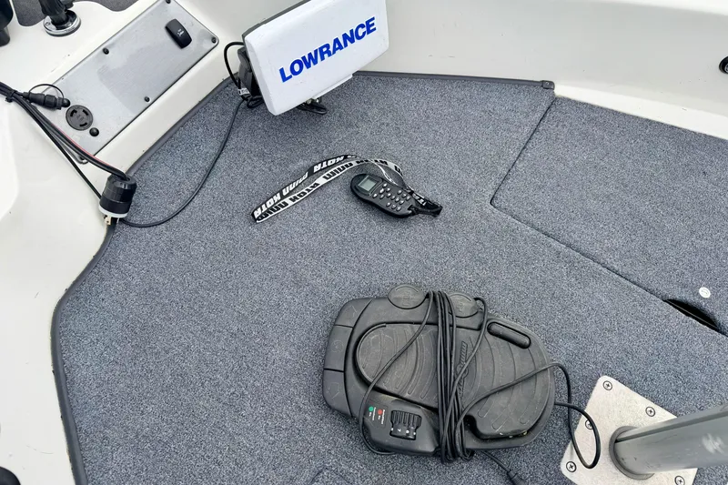 Slide: The Image of 2012 Skeeter SL 185 boat deck with Lowrance fish finder and control pedal. - 56