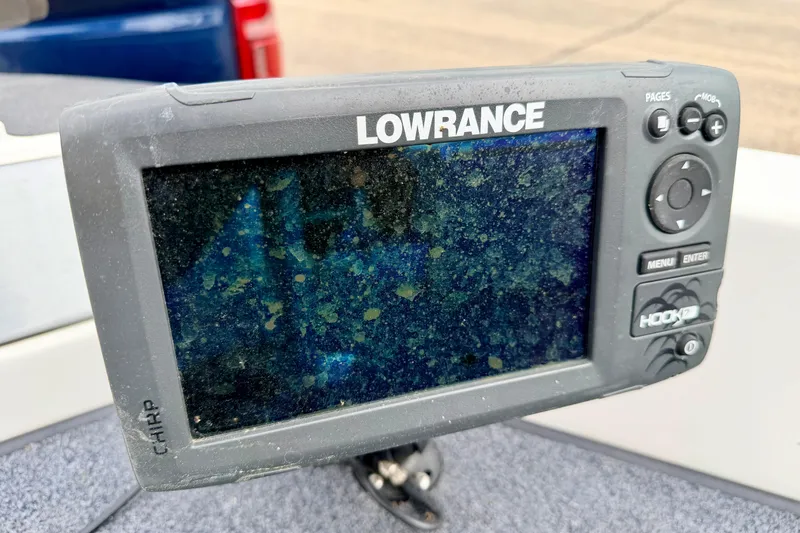 Slide: The Image of Lowrance fish finder on a 2012 Skeeter SL 185 boat, displaying a sonar screen. - 57