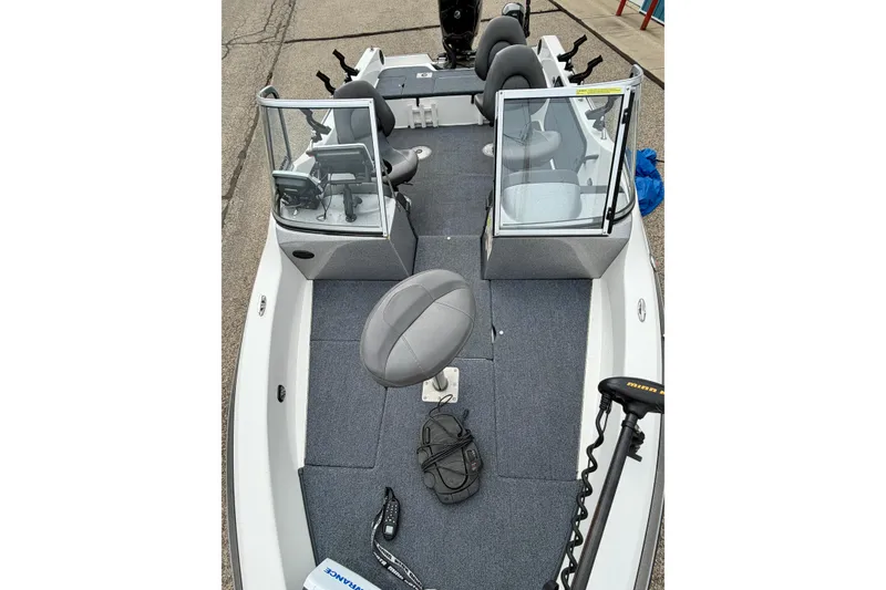 Slide: The Image of 2012 Skeeter SL 185 boat interior with seating and fishing equipment. - 59