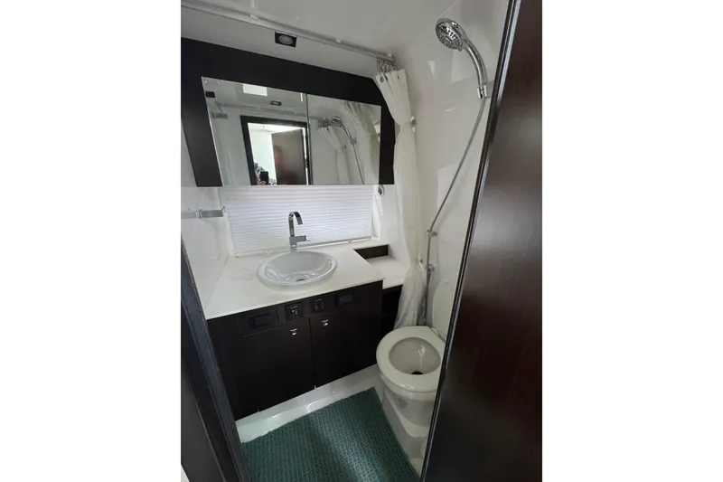 Slide: The Image of 2024 Cruisers Yachts 38 GLS OB bathroom with modern fixtures and sleek design. - 17