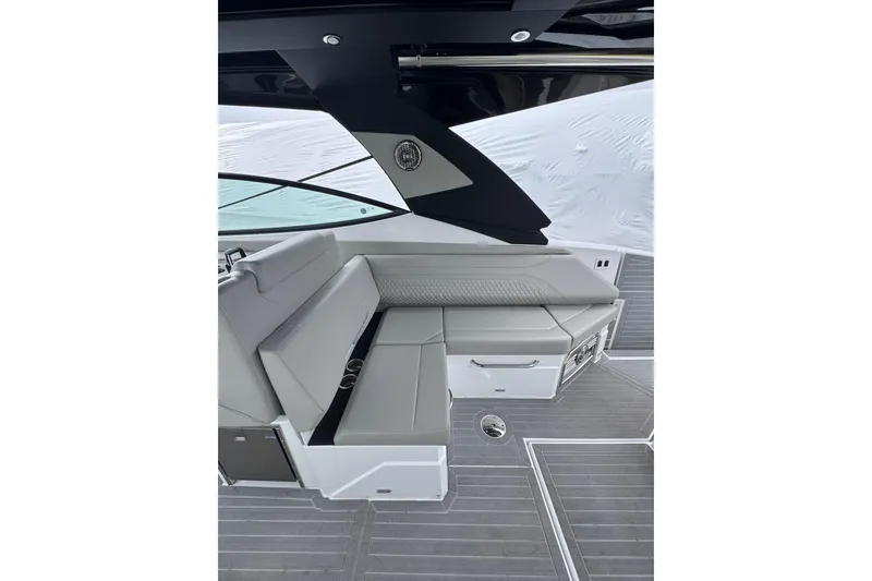 Slide: The Image of 2024 Cruisers Yachts 38 GLS OB interior with sleek seating and modern design. - 8