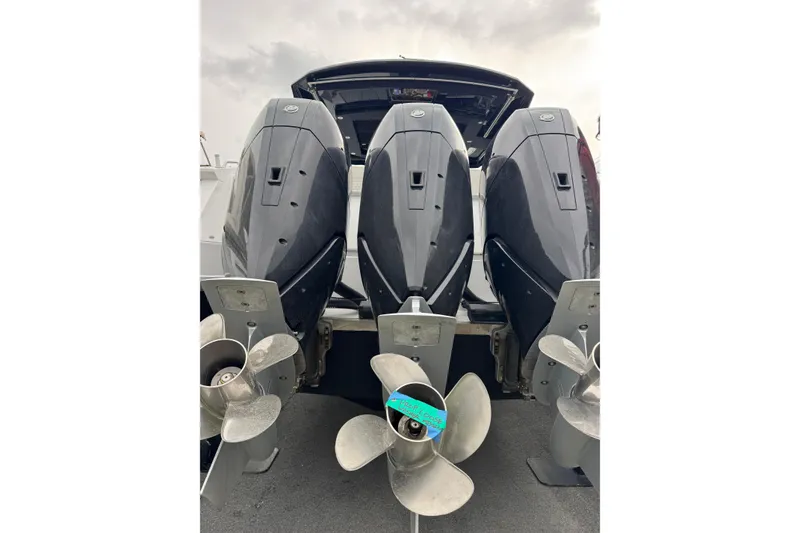 Slide: The Image of 2024 Cruisers Yachts 38 GLS OB with triple outboard engines, rear view. - 9