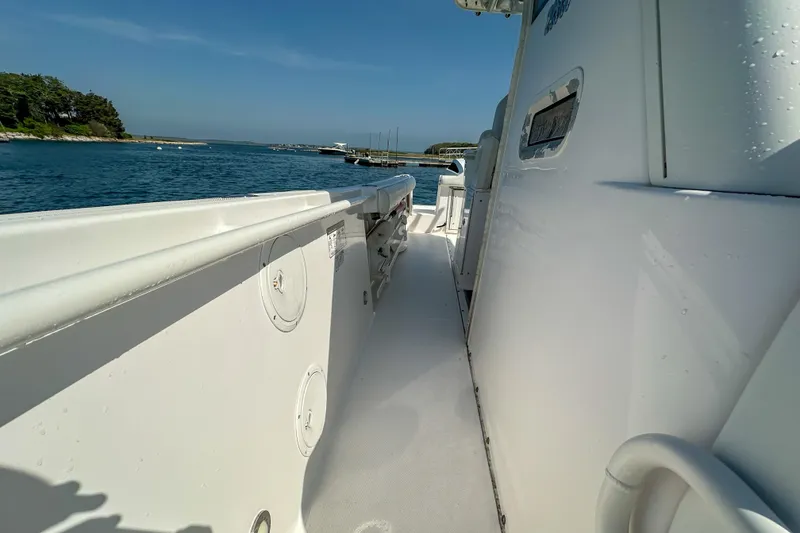 Slide: The Image of 2011 Everglades 295 Center Console boat on calm waters, side view. - 31