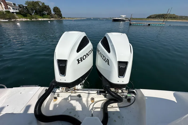 Slide: The Image of Twin Honda 250 outboard engines on a 2011 Everglades 295 Center Console boat. - 40