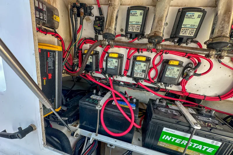 Slide: The Image of Electrical system of a 2011 Everglades 295 Center Console boat, featuring batteries and wiring. - 43