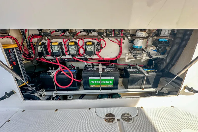 Slide: The Image of Electrical system of a 2011 Everglades 295 Center Console boat, featuring batteries and wiring. - 44