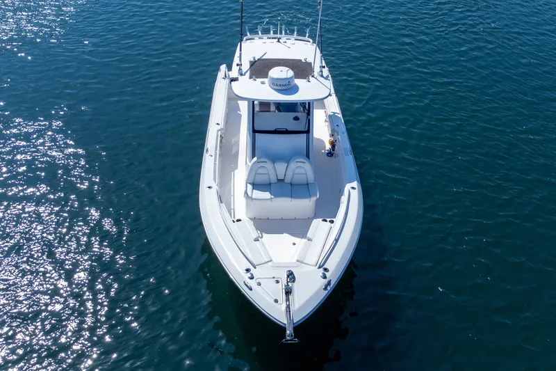 Slide: The Image of 2011 Everglades 295 Center Console boat on calm blue water, aerial view. - 6