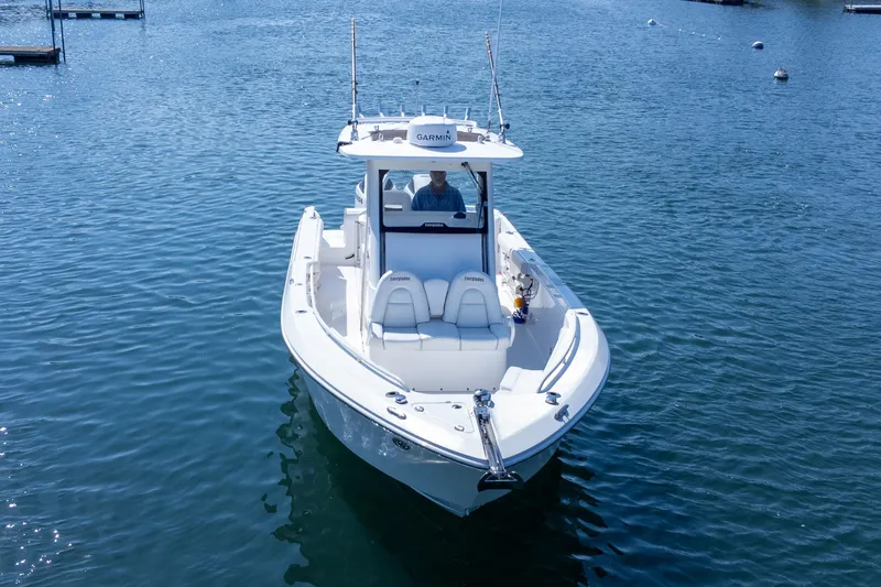 Slide: The Image of 2011 Everglades 295 Center Console boat on calm water, front view. - 7
