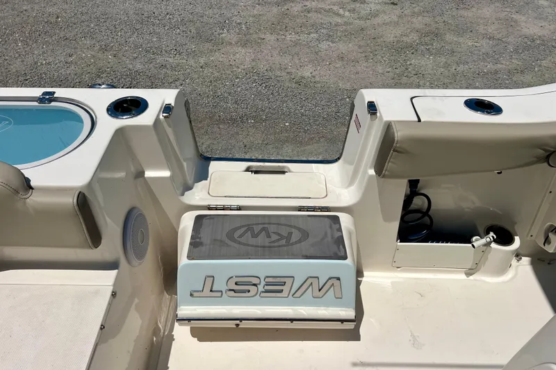 Slide: The Image of 2023 Key West 263 FS boat interior with seating and storage compartments. - 22
