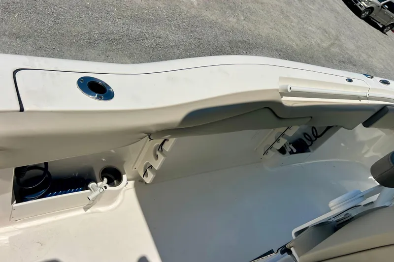 Slide: The Image of 2023 Key West 263 FS boat interior with storage compartments and seating. - 23