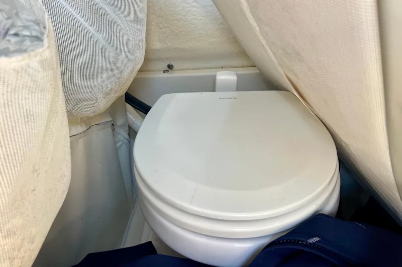 Slide: The Image of Compact marine toilet in 2023 Key West 263 FS boat cabin. - 25