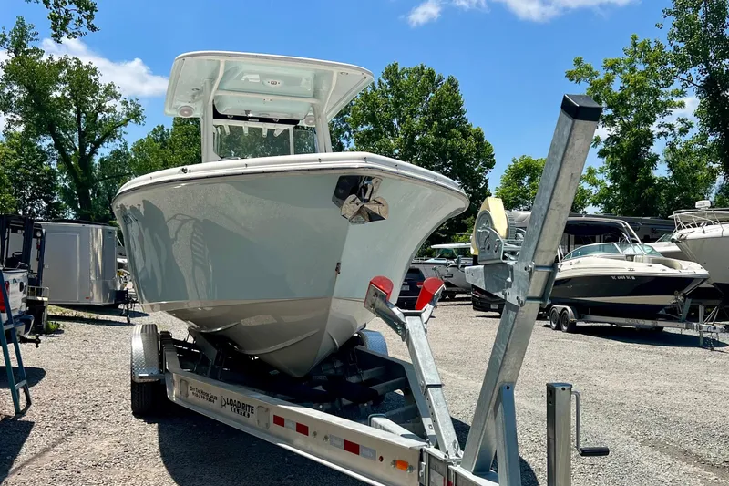 Slide: The Image of 2023 Key West 263 FS boat on trailer in sunny outdoor setting. - 5