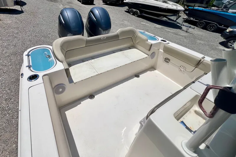 Slide: The Image of 2023 Key West 263 FS boat interior with seating and dual engines. - 9