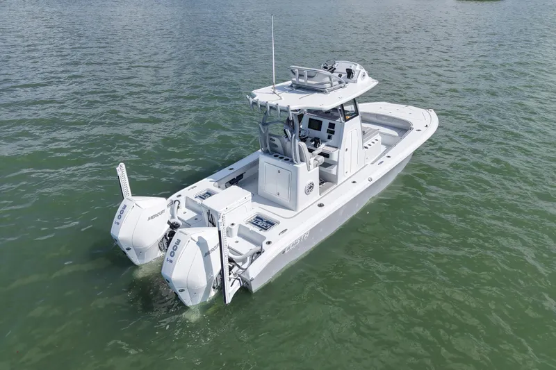 Slide: The Image of 2024 Costa Custom Boats 264HC on water, featuring dual Mercury engines. - 10