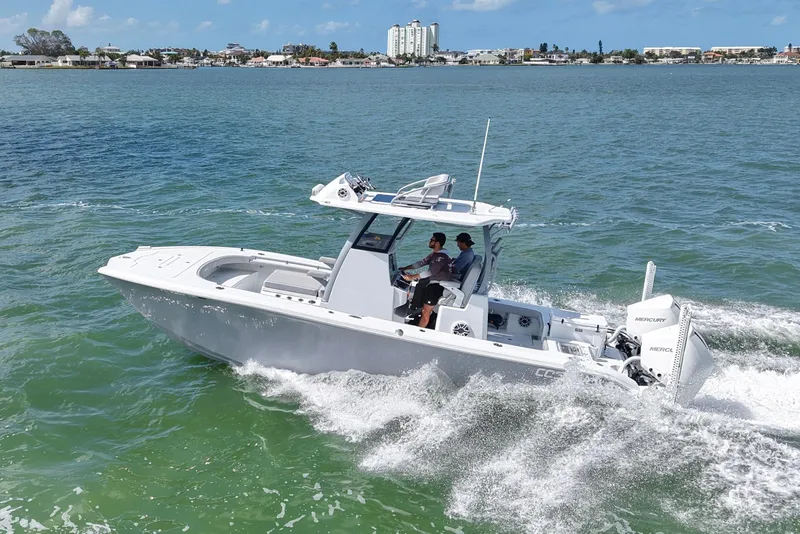 Slide: The Image of 2024 Costa Custom Boats 264HC cruising on open water, showcasing sleek design and powerful performance. - 13