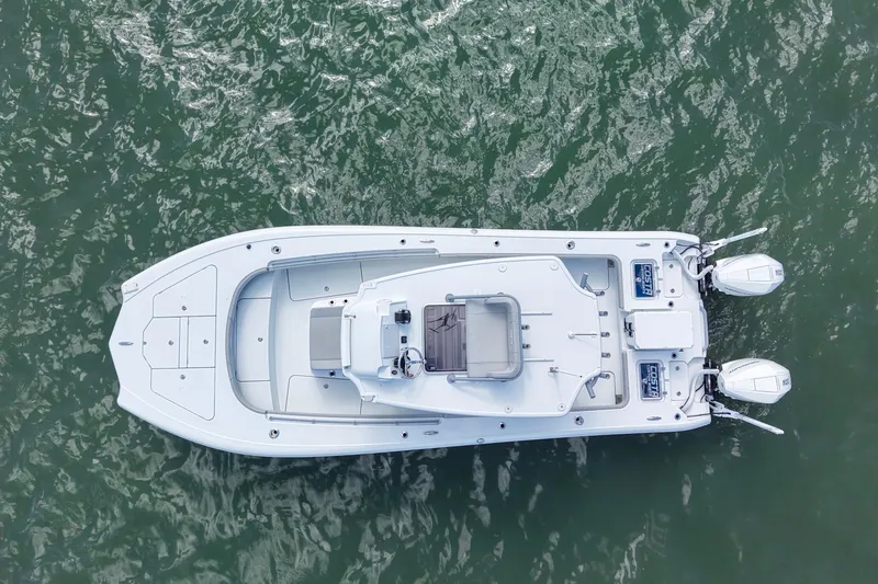 Slide: The Image of Top view of 2024 Costa Custom Boats 264HC on water, showcasing sleek design and dual engines. - 15