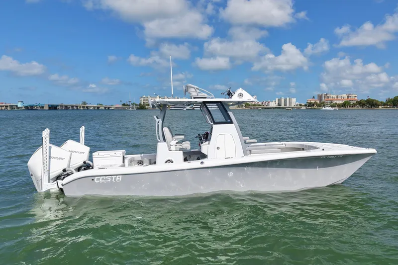 Slide: The Image of 2024 Costa Custom Boats 264HC on water, showcasing sleek design and powerful Mercury engines. - 3