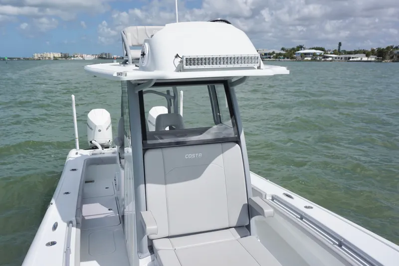 Slide: The Image of 2024 Costa Custom Boats 264HC on water, showcasing sleek design and modern features. - 33