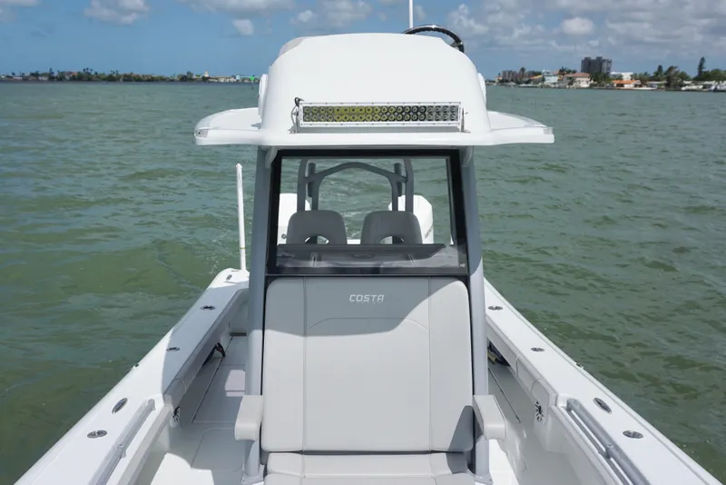 Slide: The Image of 2024 Costa Custom Boats 264HC on calm water, showcasing sleek design and modern features. - 34
