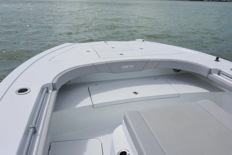 Slide: The Image of 2024 Costa Custom Boats 264HC bow view on calm water. - 36