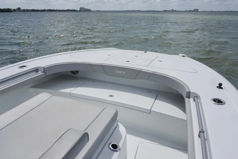 Slide: The Image of 2024 Costa Custom Boats 264HC on open water, showcasing sleek design and spacious seating. - 37