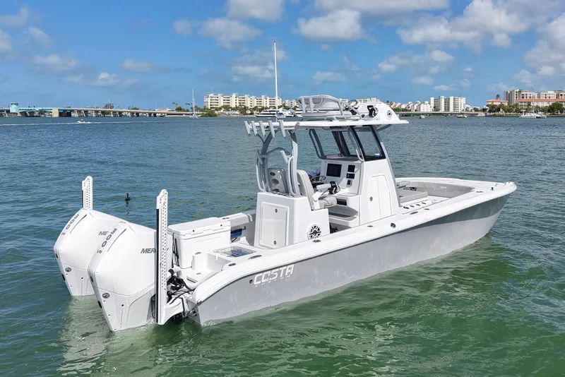 Slide: The Image of 2024 Costa Custom Boats 264HC on water, showcasing sleek design and powerful engines. - 5
